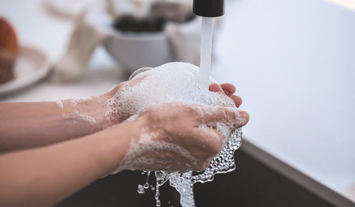 a person washing hands